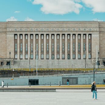 The Finnish Parliament building on a clear day