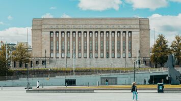 The Finnish Parliament building on a clear day