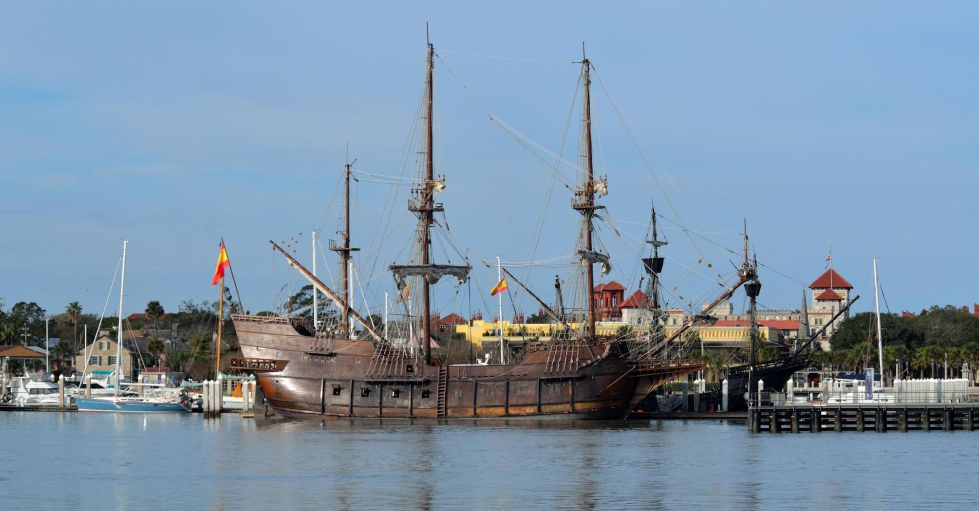 17th-century Spanish galleon replica docked in a sunny harbor