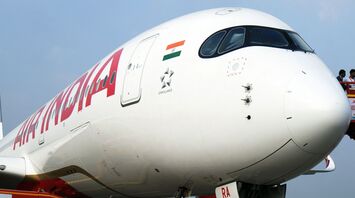 Air India aircraft at an airport with visible logos