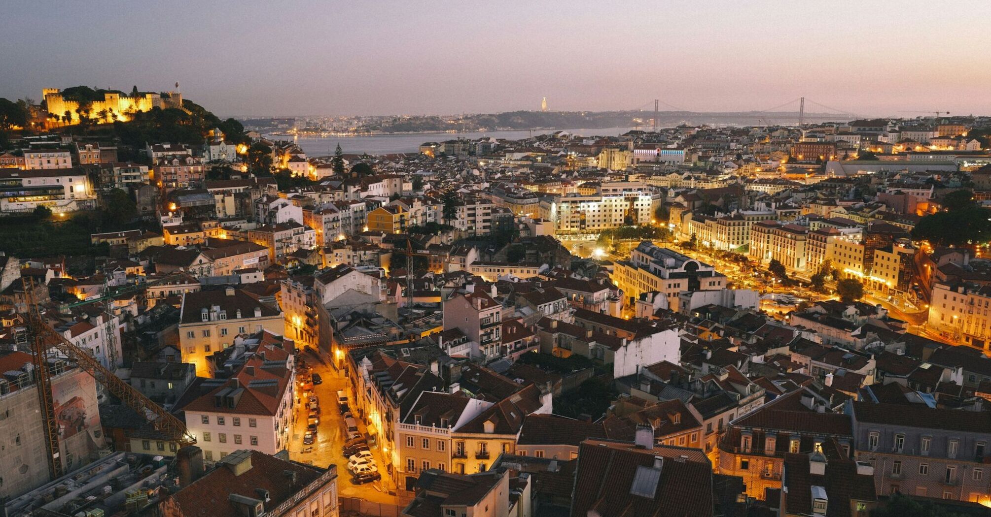 Evening cityscape of Lisbon with illuminated streets and buildings