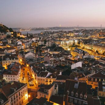 Evening cityscape of Lisbon with illuminated streets and buildings