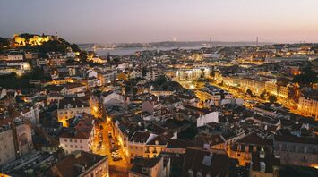 Evening cityscape of Lisbon with illuminated streets and buildings