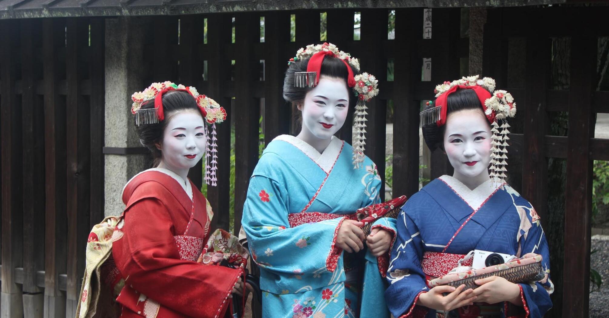 Three women dressed in traditional Japanese kimonos, showcasing Japan's rich cultural heritage