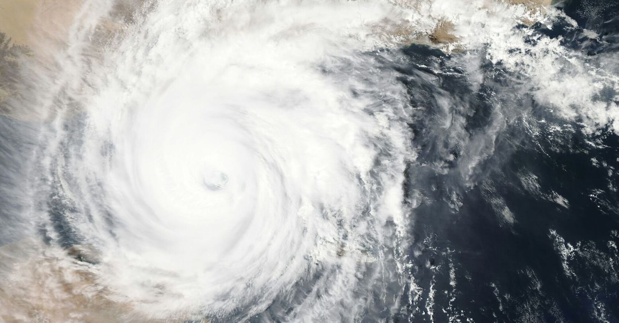 Satellite image of Typhoon swirling, illustrating the storm's massive size and its impact on the region's weather patterns