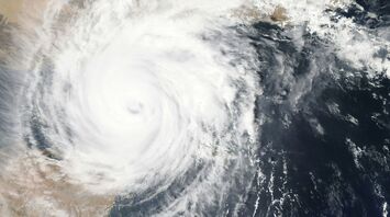 Satellite image of Typhoon swirling, illustrating the storm's massive size and its impact on the region's weather patterns