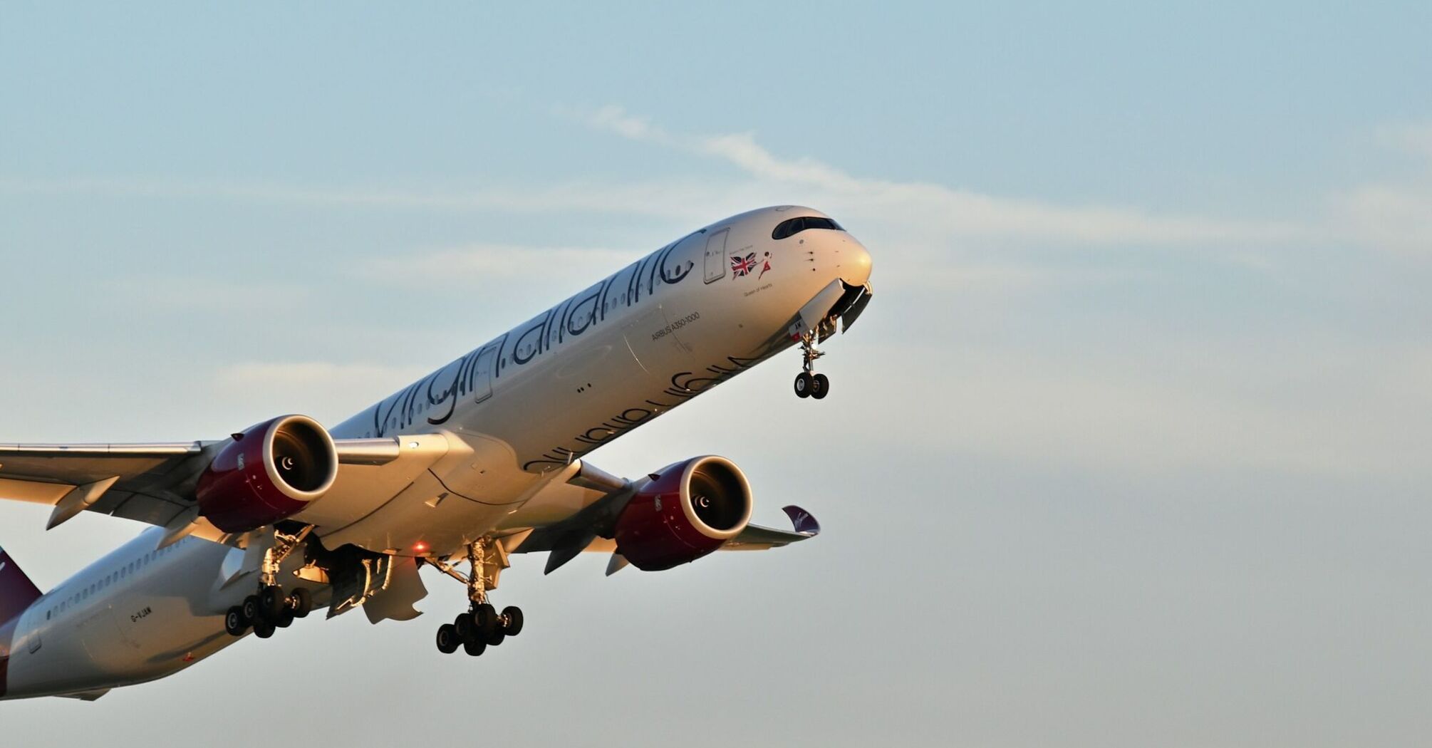 Virgin Atlantic aircraft taking off against a clear sky