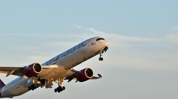 Virgin Atlantic aircraft taking off against a clear sky