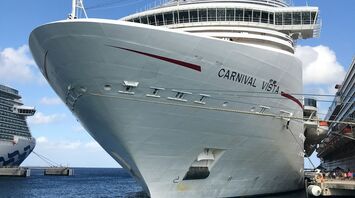 Carnival Vista cruise ship docked at a port