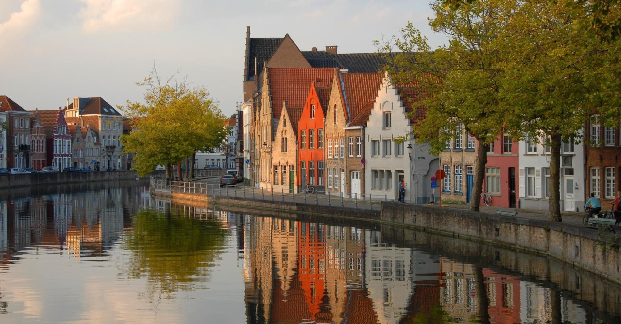 Scenic canal view with traditional buildings in Bruges, Belgium