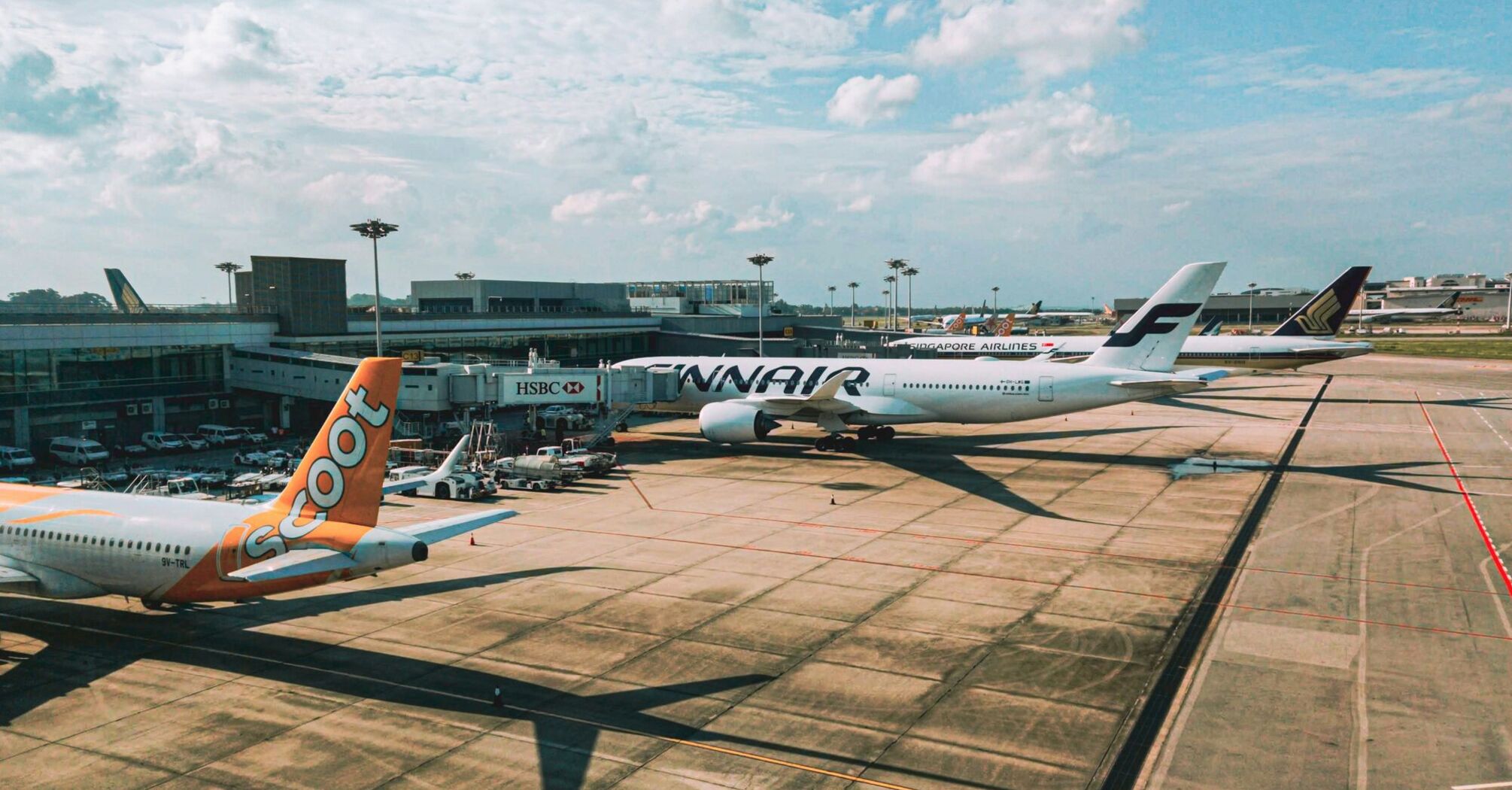 a couple of airplanes that are on a runway