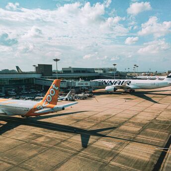 a couple of airplanes that are on a runway