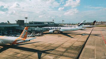 a couple of airplanes that are on a runway