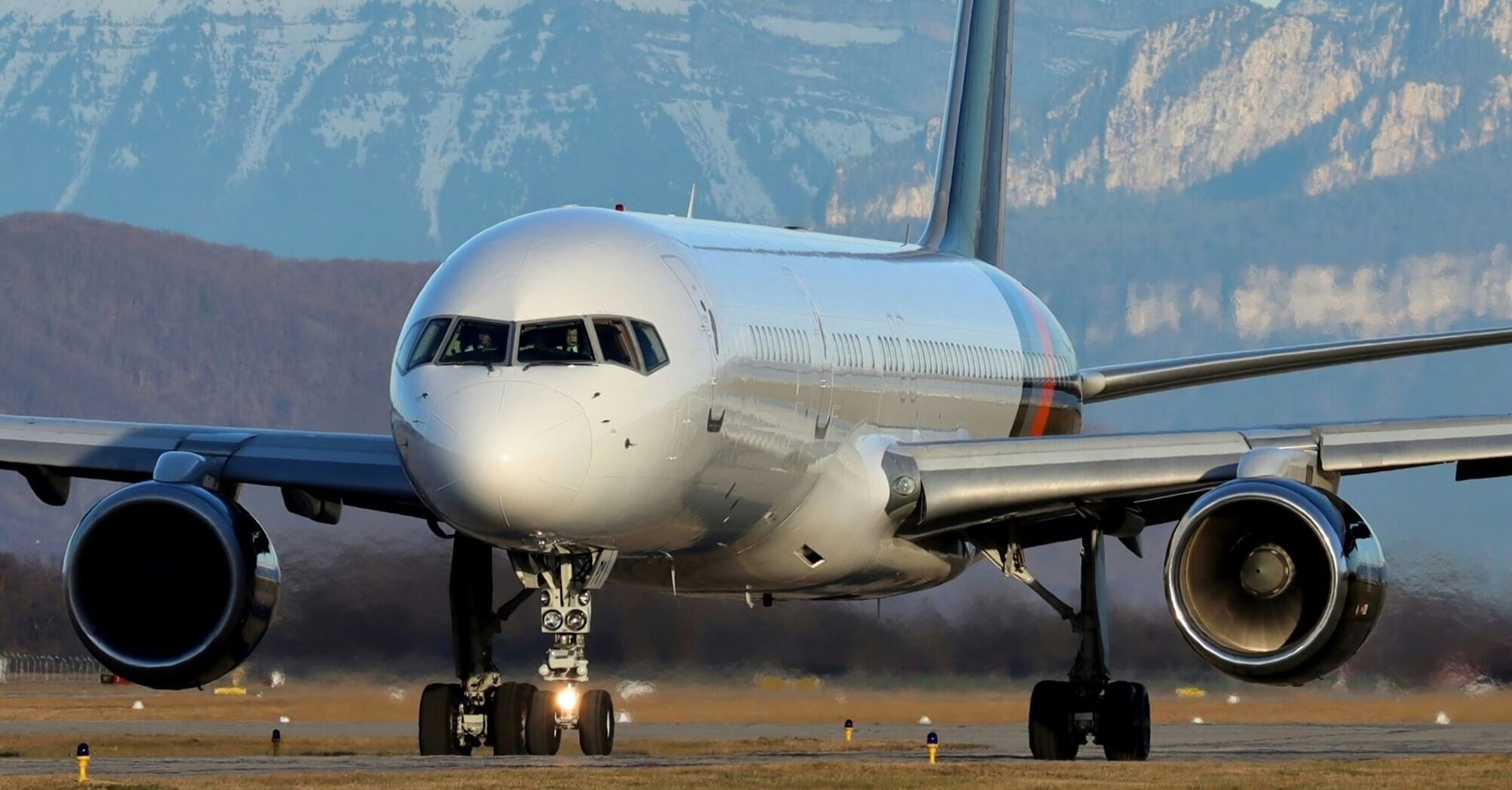 a large jetliner sitting on top of an airport runway 