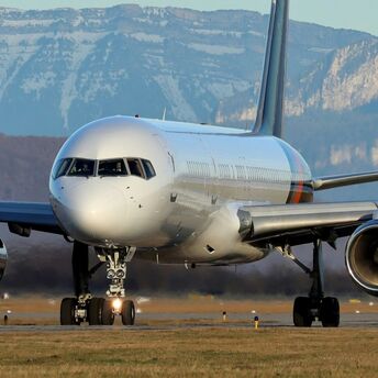 a large jetliner sitting on top of an airport runway