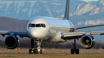 a large jetliner sitting on top of an airport runway