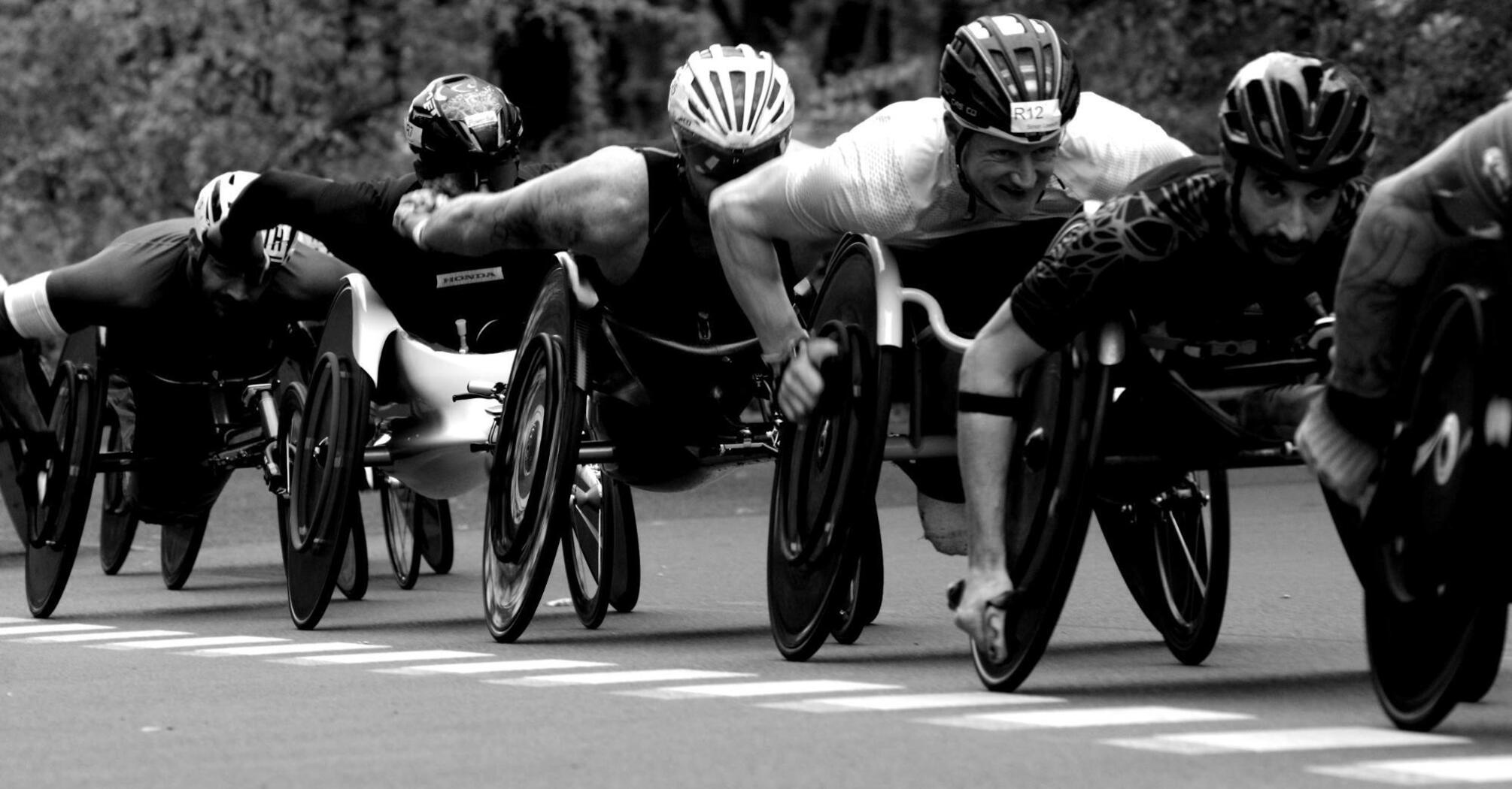 Athletes with disabilities fiercely competing in a wheelchair race