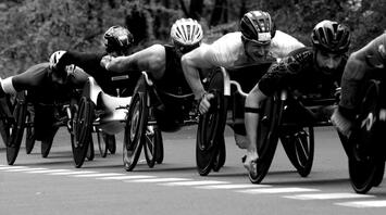 Athletes with disabilities fiercely competing in a wheelchair race