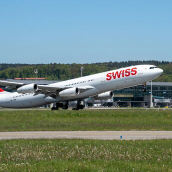 A SWISS aircraft taking off from Zurich Airport on a clear day