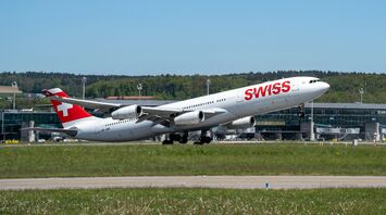 A SWISS aircraft taking off from Zurich Airport on a clear day