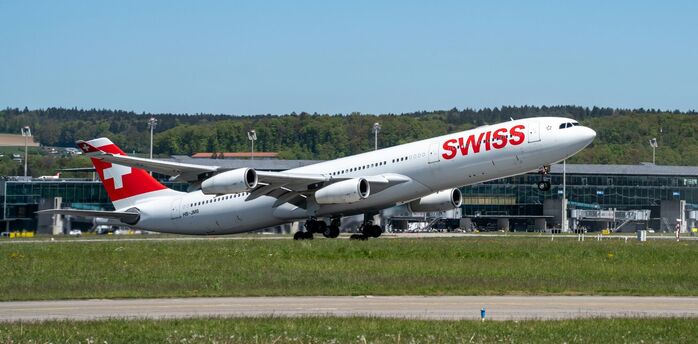 A SWISS aircraft taking off from Zurich Airport on a clear day