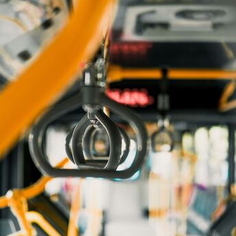 Interior of a public bus showing handrails and seats