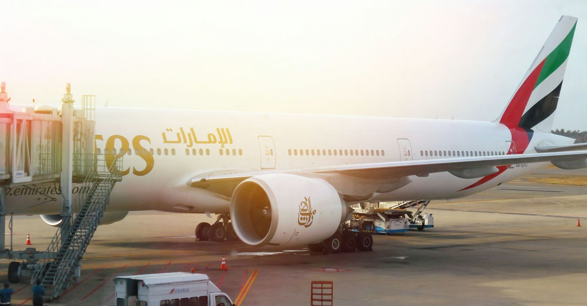 Emirates aircraft parked at an airport gate