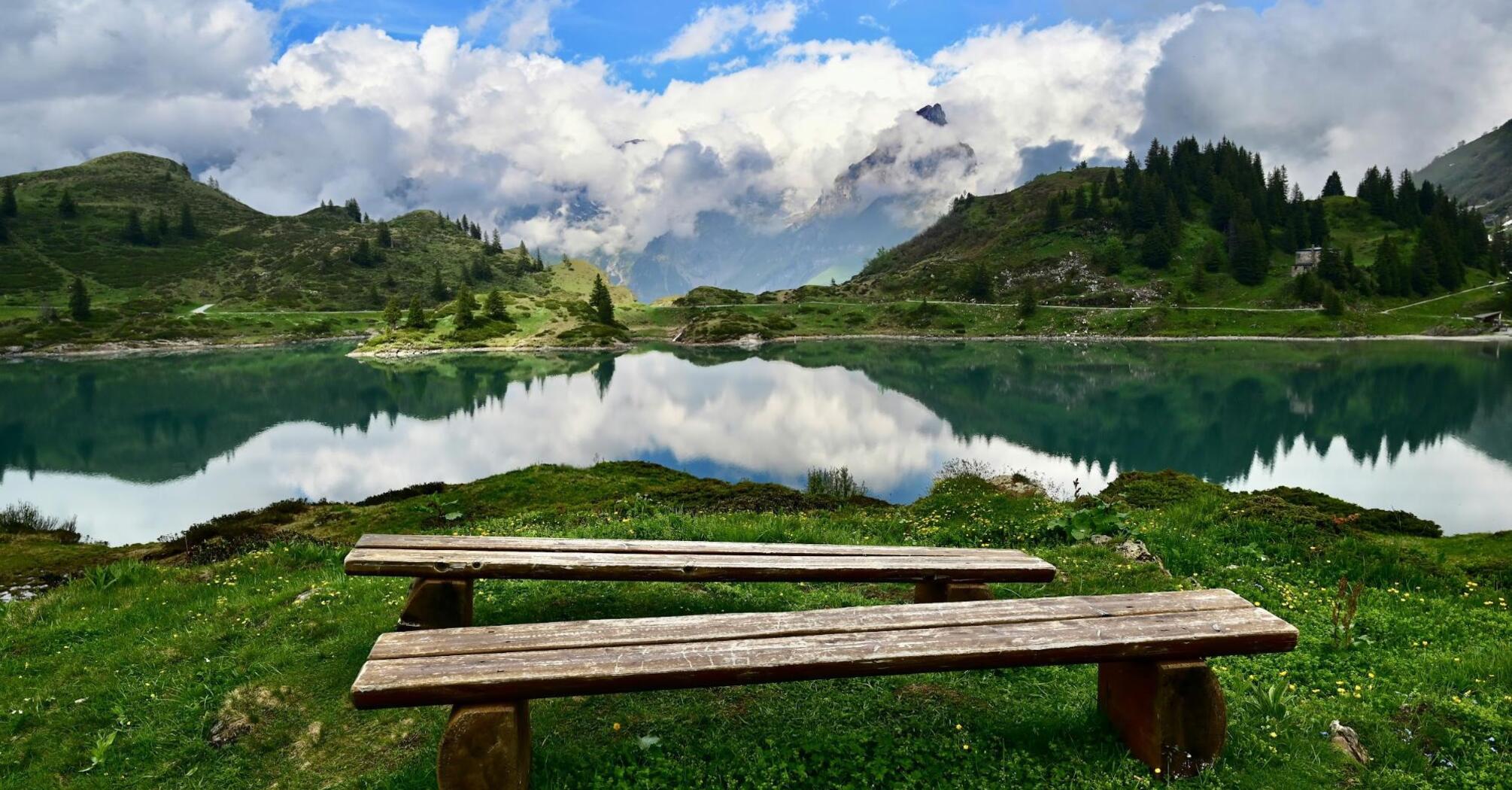 Peaceful Alpine lake surrounded by mountains