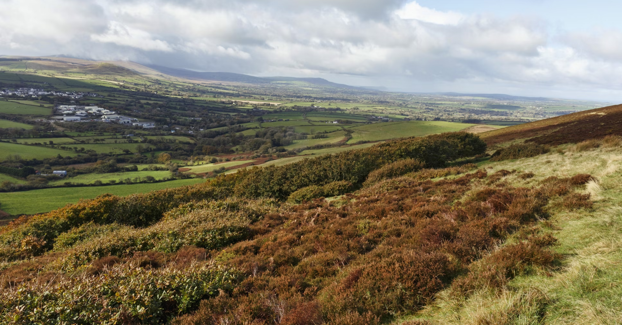 Panoramic view of Gwaun Valley in Wales, showcasing rolling hills and lush greenery