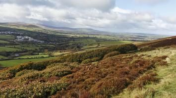 Panoramic view of Gwaun Valley in Wales, showcasing rolling hills and lush greenery