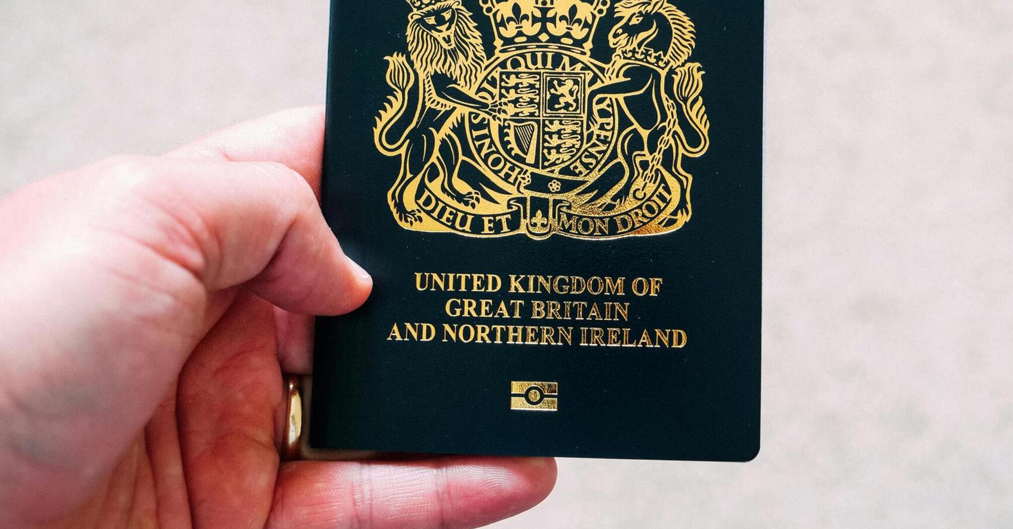 A British passport being held