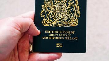 A British passport being held