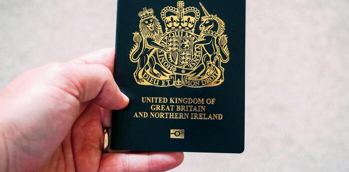 A British passport being held
