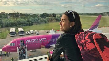 Traveller looking at Wizz Air plane