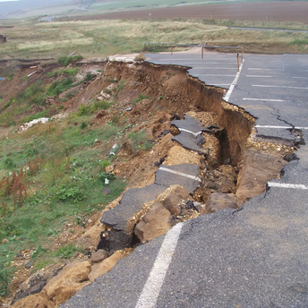 Collapsed road after earthquake damage near the coast
