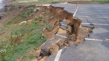 Collapsed road after earthquake damage near the coast