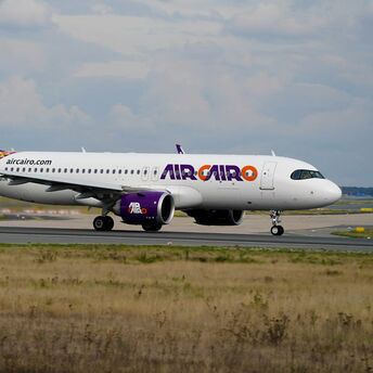 Air Cairo aircraft taxiing on the runway