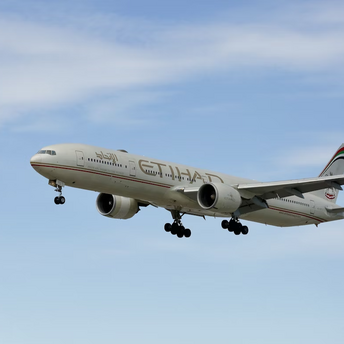 Etihad Airways airplane flying in clear sky