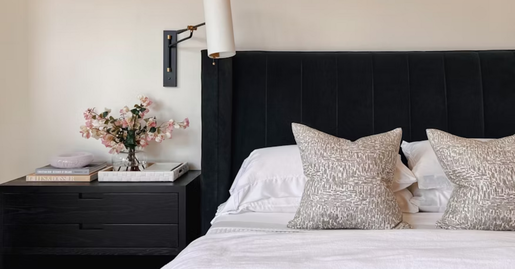 Modern hotel bedroom with elegant decor and neutral tones