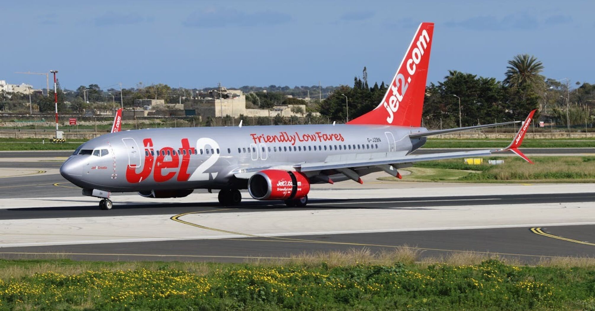 Jet2.com aircraft taxiing on the runway at an airport