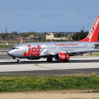Jet2.com aircraft taxiing on the runway at an airport