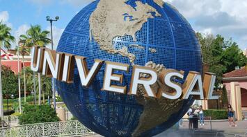 Universal Studios globe monument at a theme park entrance