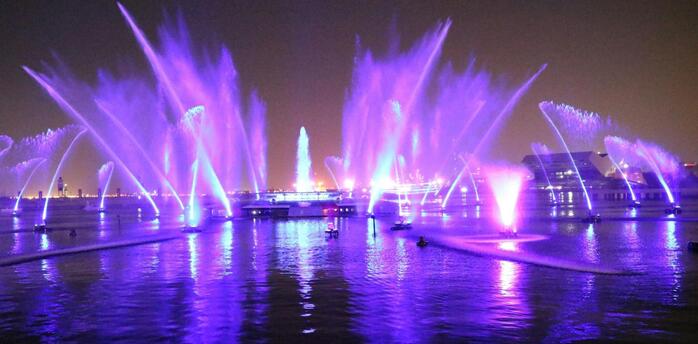Colorful light fountains illuminating Liverpool’s waterfront at night during the River of Light festival