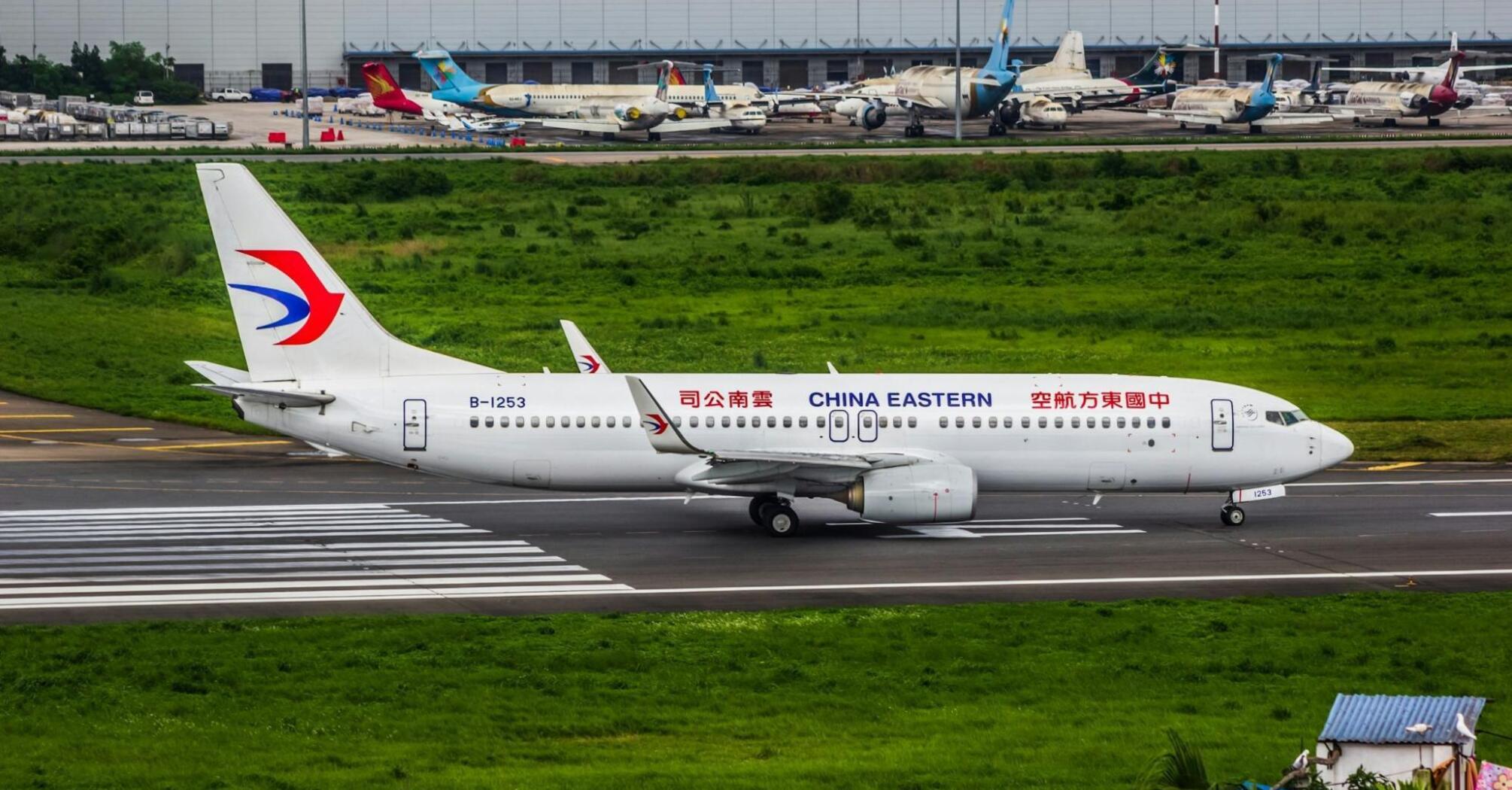China Eastern Airlines aircraft taxiing on the runway before departure at a major Chinese airport