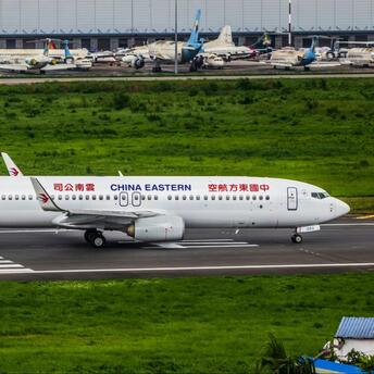 China Eastern Airlines aircraft taxiing on the runway before departure at a major Chinese airport