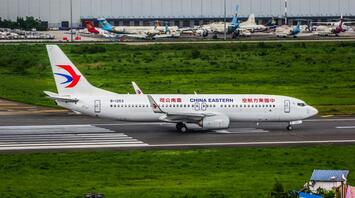 China Eastern Airlines aircraft taxiing on the runway before departure at a major Chinese airport