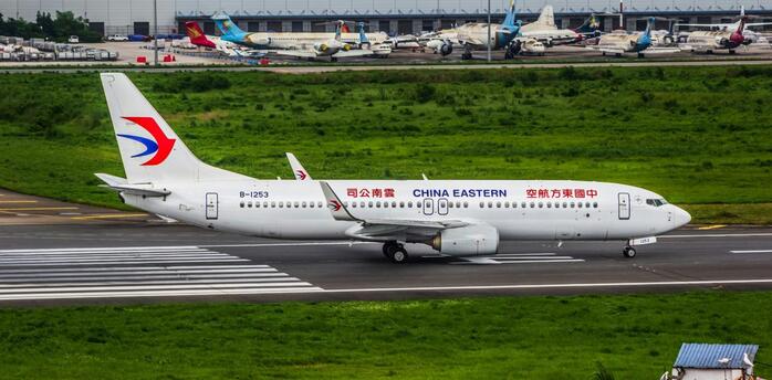 China Eastern Airlines aircraft taxiing on the runway before departure at a major Chinese airport