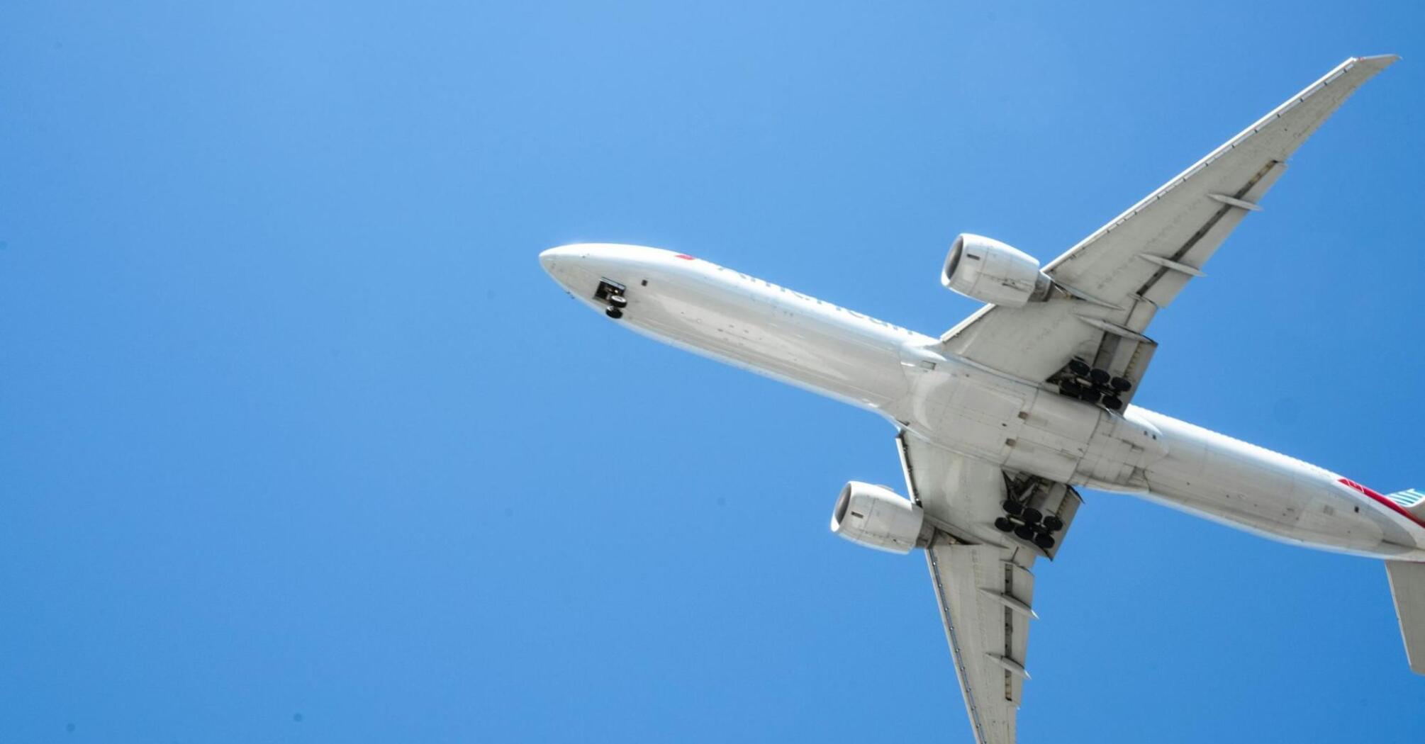 Airplane flying against a clear blue sky