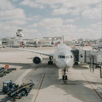 Airplane preparing for departure at a busy international airport terminal