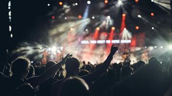 Crowd enjoying a live concert under stage lights in Edinburgh
